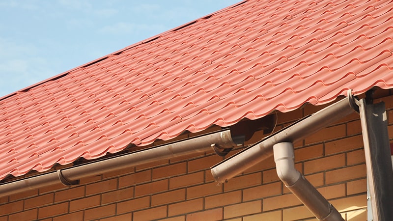 Broken gutter system falling off of a house