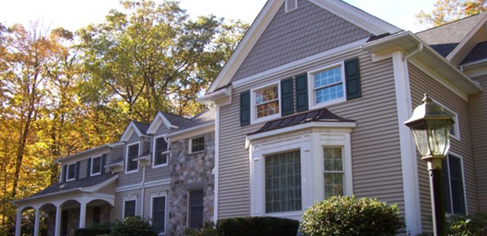 LeafGuard gutters shown on a custom traditional home