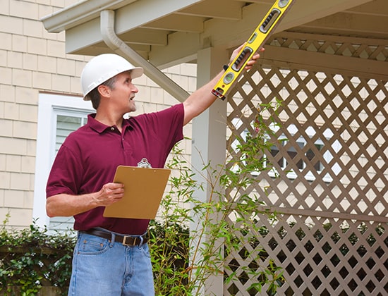 Gutter installation professional on a home