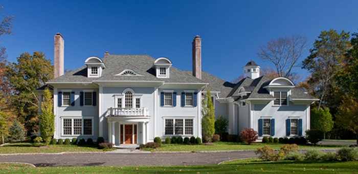 LeafGuard gutters shown on a large victorian home